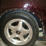 Before and after photographs of a damaged Chevy Impala that was repaired by Elite Paint & Body Shop in West Palm Beach, Florida.